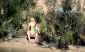 exciting-blonde-having-fun-with-her-boyfriend-by-the-river