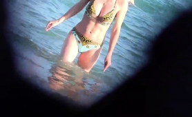 Beach Voyeur Captures A Sexy Slender Babe In A Tight Bikini