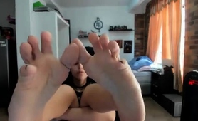 alluring-teen-showing-off-her-footjob-abilities-on-webcam