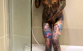 Tattooed Beauty Indulges In Hot Masturbation In The Shower
