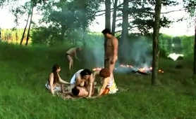 lusty-mature-ladies-sharing-cock-in-wild-orgy-outdoors