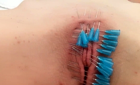 kinky-teen-gets-her-shaved-cunt-sealed-shut-with-needles